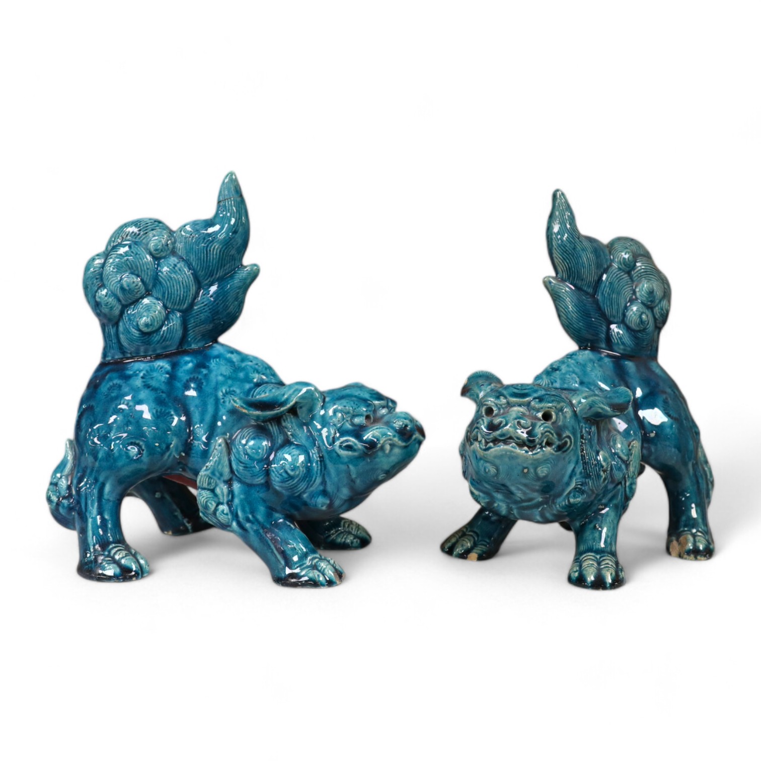 A pair of Japanese ‘shi-shi’ dog figures, blue glaze finish. 19cm. Condition - poor to fair